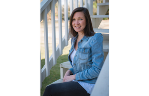 Girl wearing adult denim jacket with puff sleeve shoulder detail